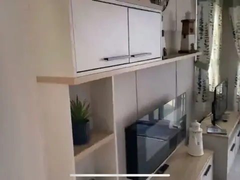 Lounge storage units and a TV